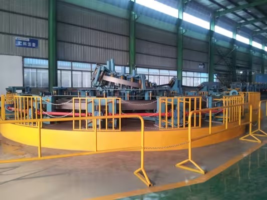 Hydrostatic pipe testing equipment with safety enclosure in a factory workshop